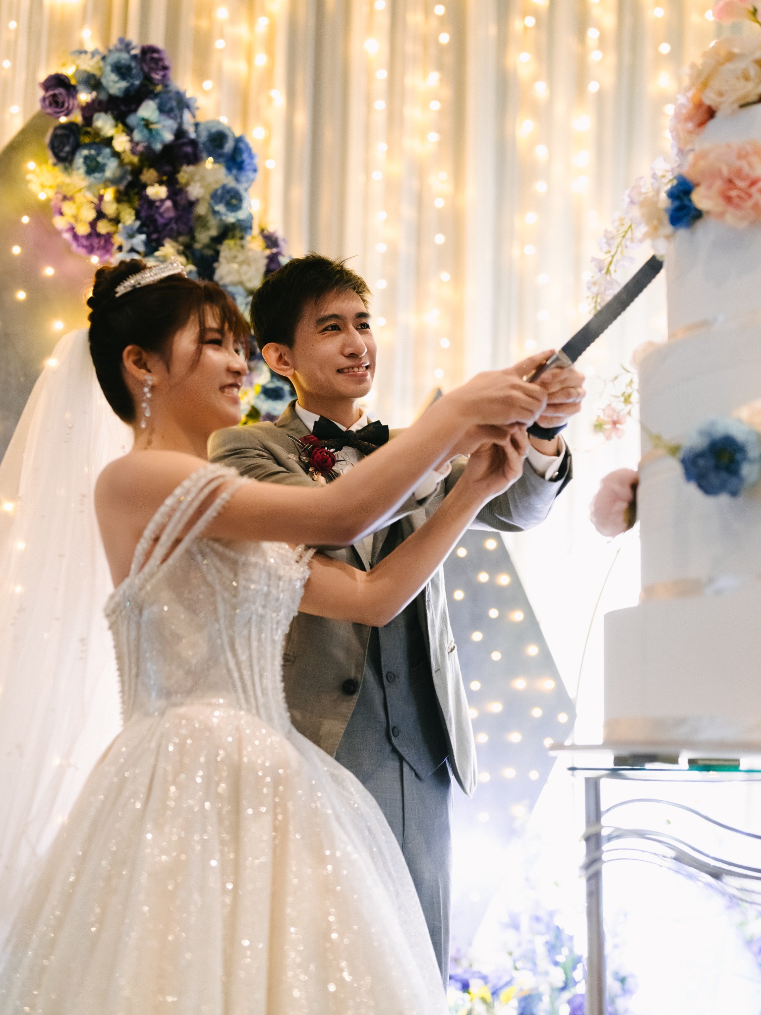 Couple cutting their wedding cake